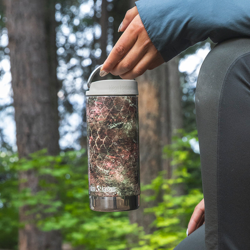 12oz-tkwide-with-cafe-cap-mossy-oak-v4 12oz_tumbler_mossyoak_rainbowtrout_hand_closeup_square.jpg