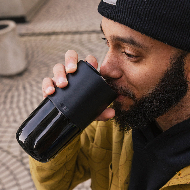 daily-on-the-go-set-q0 16oz_rise_tumbler_black_man_drink_square.jpg