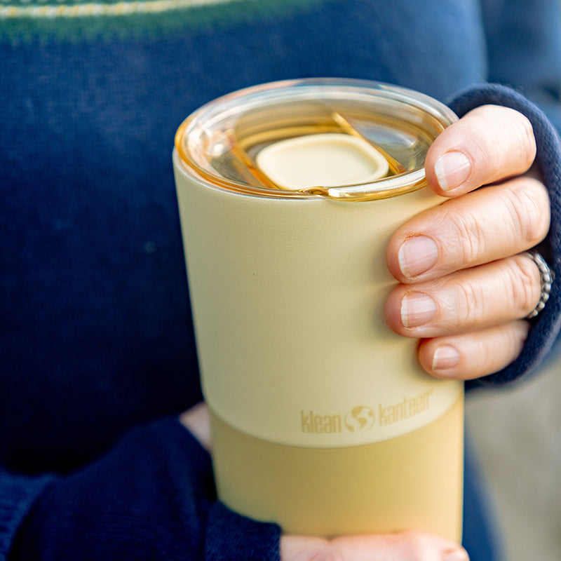daily-on-the-go-set-q0 16oz_rise_tumbler_wax_yellow_closeup_hand_lid_square.jpg