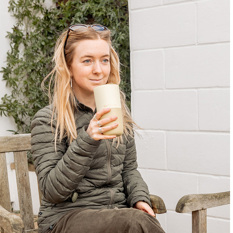 16oz-rise-tumbler-w1 16oz_rise_tumbler_wax_yellow_woman_seat_outside_square.jpg