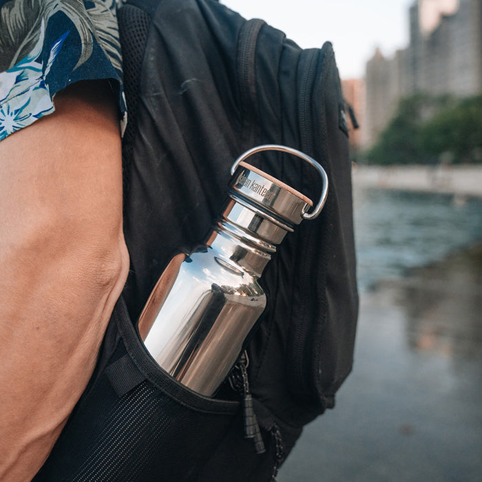 27oz-reflect-with-bamboo-cap-l8 K27SSLRF-MS-BAMBOO_reflect-bottle_backpack_lifestyle.jpg